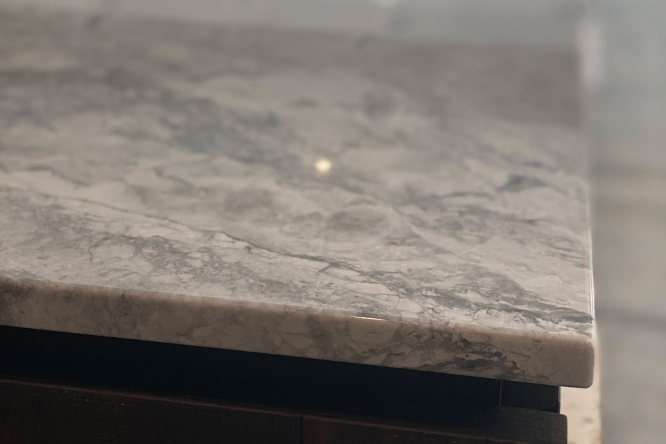 Bianca Eclipsia Quartzite (cabinetry by Galerie Designs)