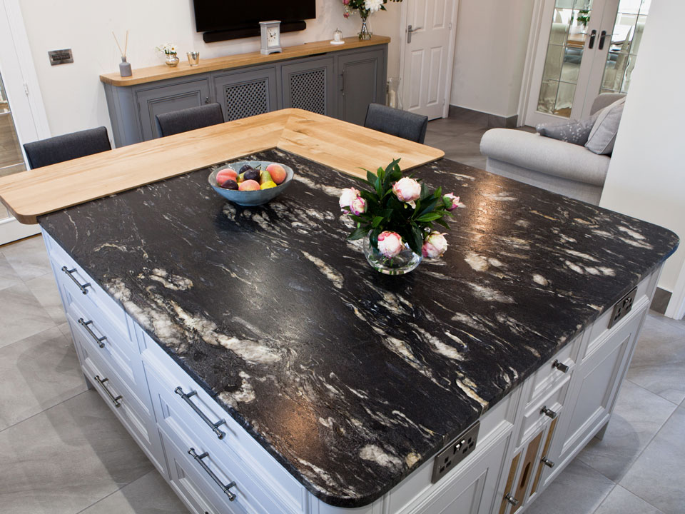 Silestone Lagoon & Cosmic Black Leather Granite (cabinetry by Grand Union Designs)