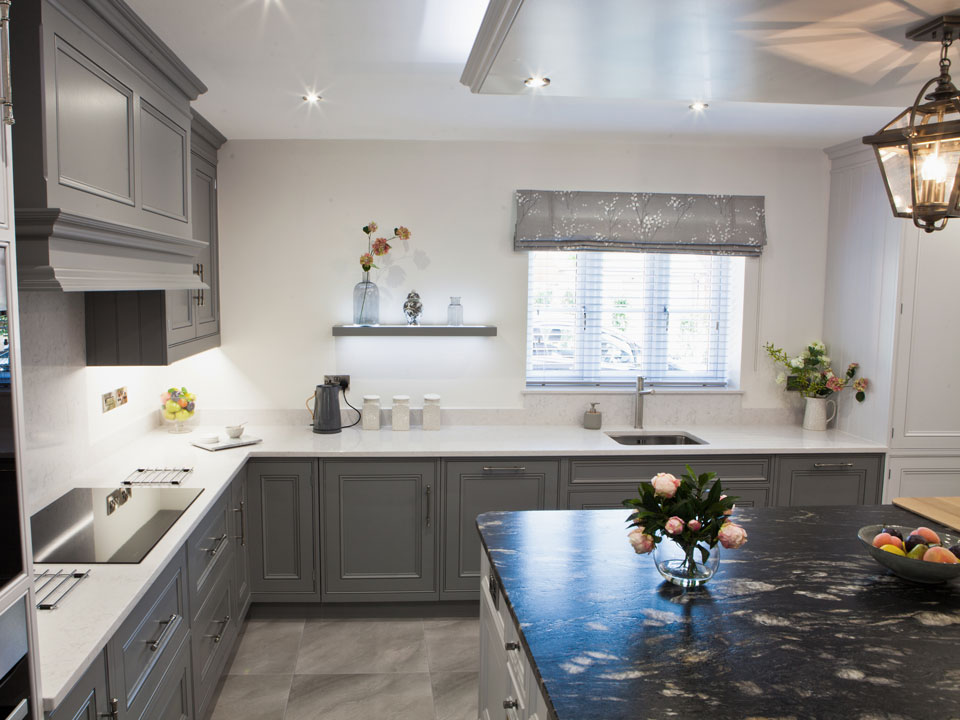 Silestone Lagoon & Cosmic Black Leather Granite (cabinetry by Grand Union Designs)