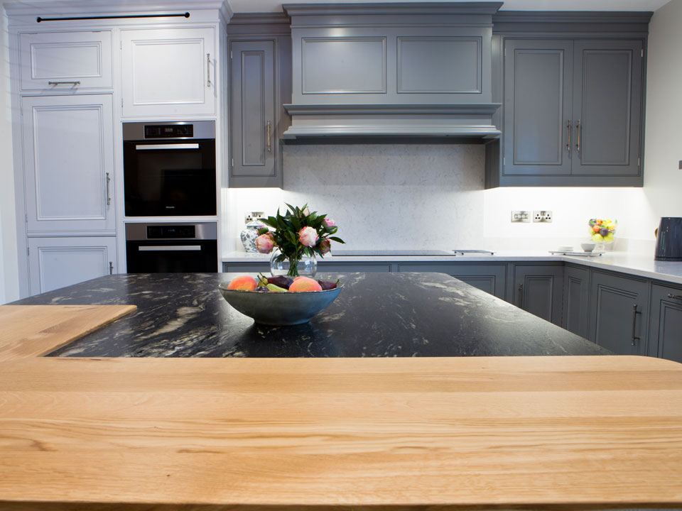 Silestone Lagoon & Cosmic Black Leather Granite (cabinetry by Grand Union Designs)