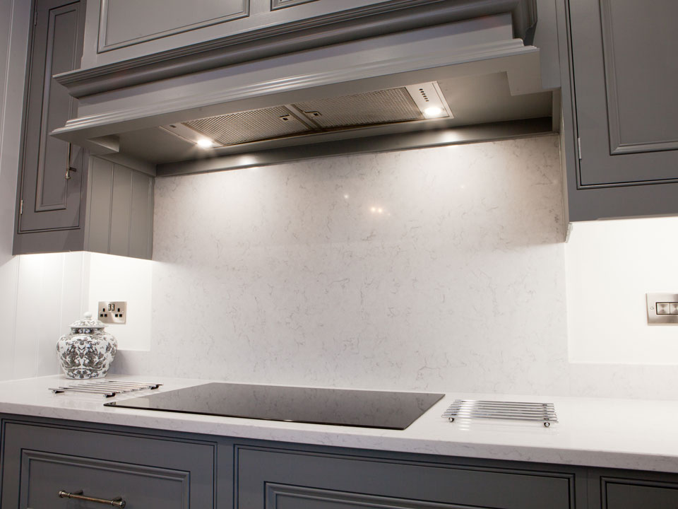 Silestone Lagoon & Cosmic Black Leather Granite (cabinetry by Grand Union Designs)