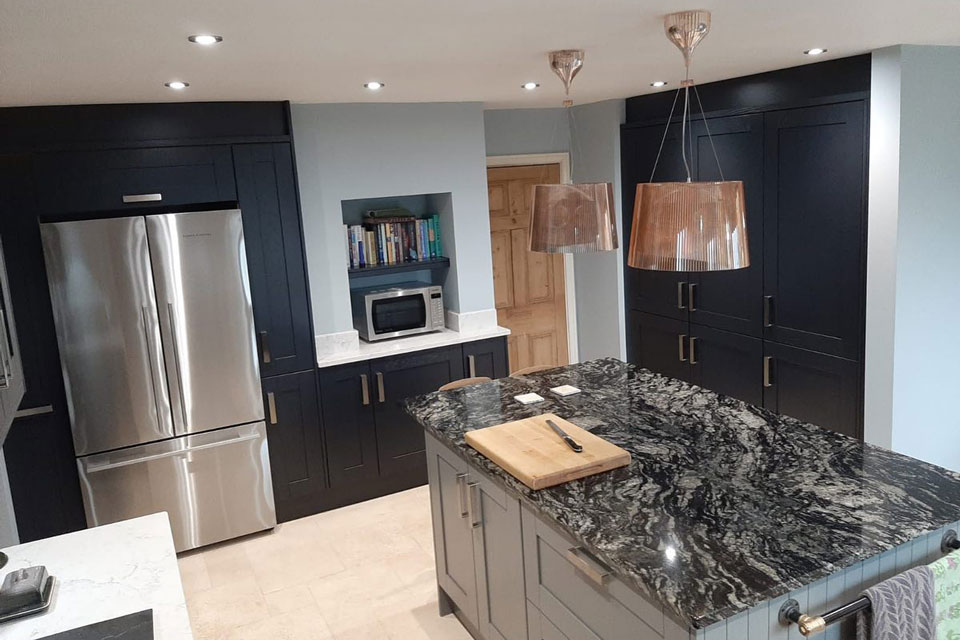 AG Quartz Fusion White & Indian Black Sensa Granite (cabinetry by Trademark Kitchens & Bathrooms)