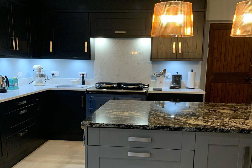 AG Quartz Fusion White & Indian Black Sensa Granite (cabinetry by Trademark Kitchens & Bathrooms)