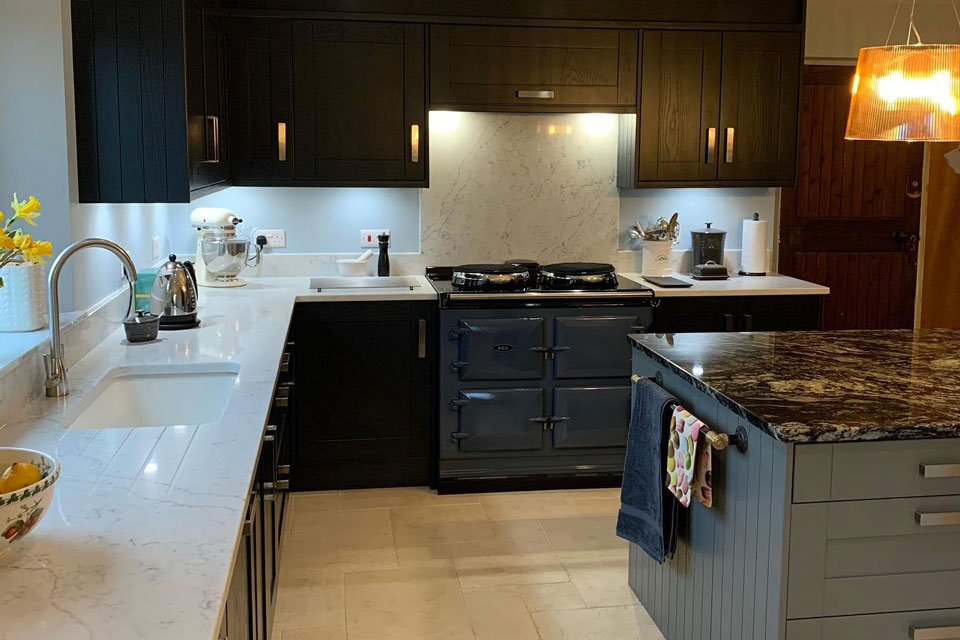 AG Quartz Fusion White & Indian Black Sensa Granite (cabinetry by Trademark Kitchens & Bathrooms)