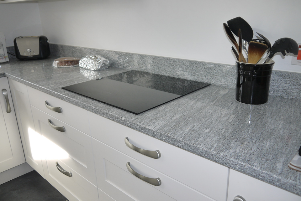 White Storm Granite (cabinetry by Cloisters Design)