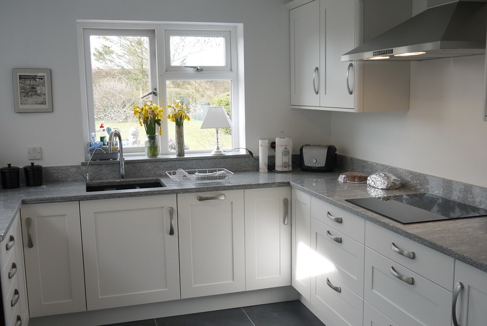 White Storm Granite (cabinetry by Cloisters Design)